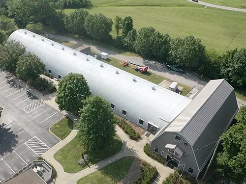 Spray polyurethane foam roofing system on a commercial building